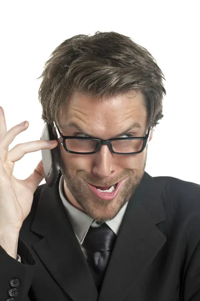 Homem de negócios fazendo cara engraçada falando ao telefone — Fotografia de Stock