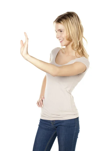 Smiling young woman waving hand — Stock Photo, Image