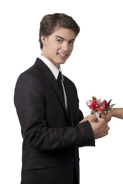Hombre guapo fijando pulsera de flores en una mano humana —  Fotos de Stock