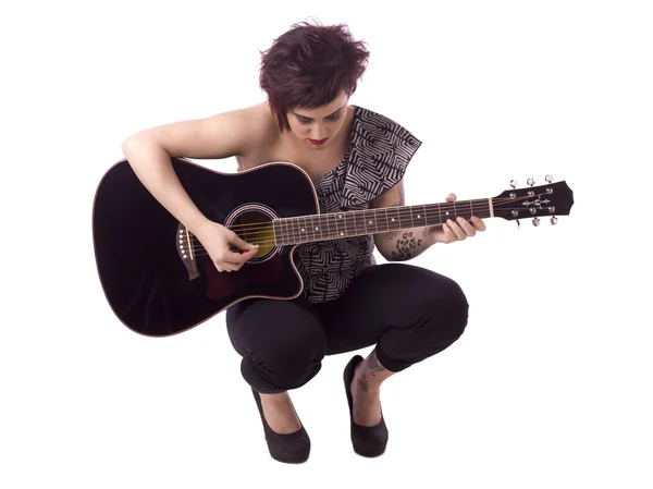Fêmea tocando guitarra — Fotografia de Stock