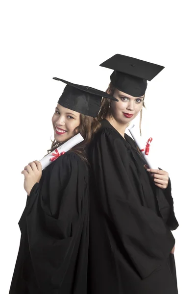 Two graduating students holding their diploma — Stock Photo, Image