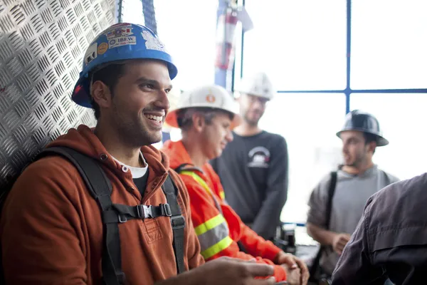 Architect with colleagues in the background — Stock Photo, Image