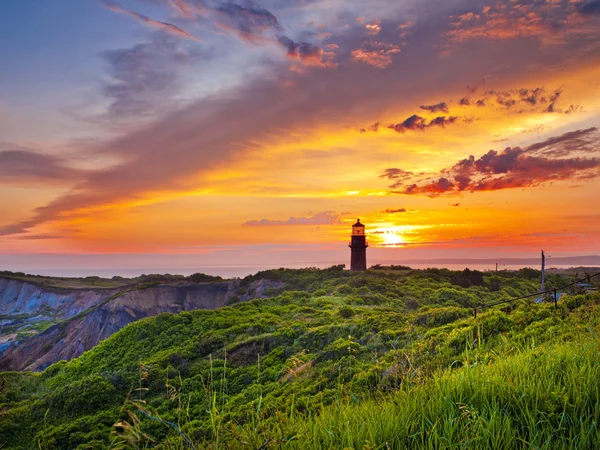 Zonsondergang op een vuurtoren — Stockfoto