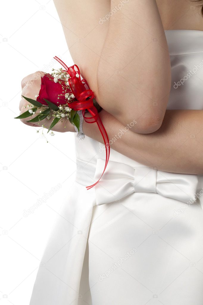 red rose corsage on the females wrist