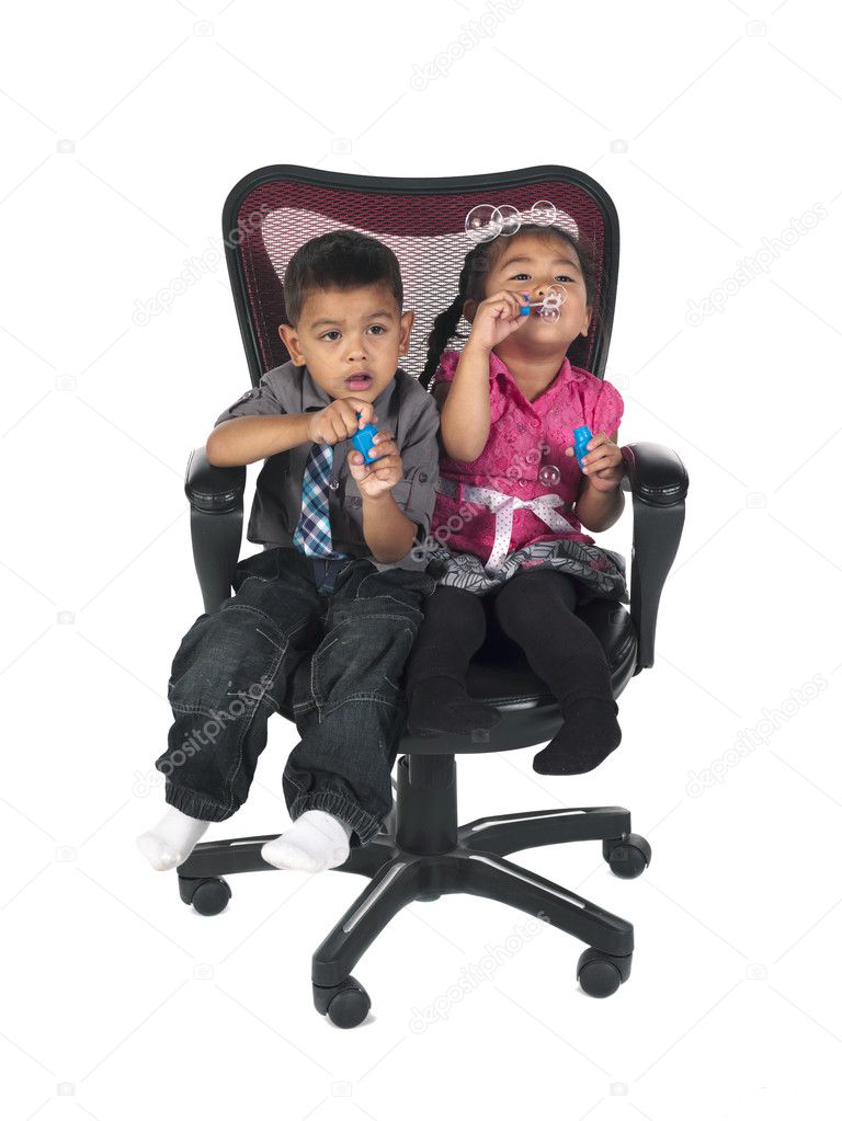 asian kids playing with bubble wand