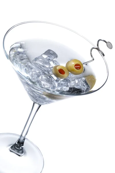 Martini glass with olive fruits and ice cubes — Stock Photo, Image