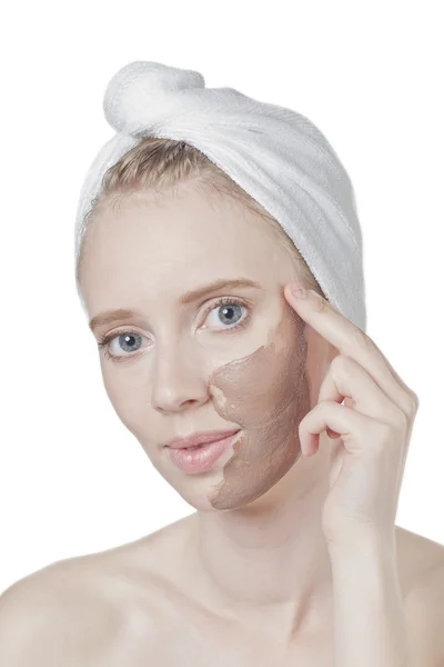 Woman putting chocolate face mask — Stock Photo, Image