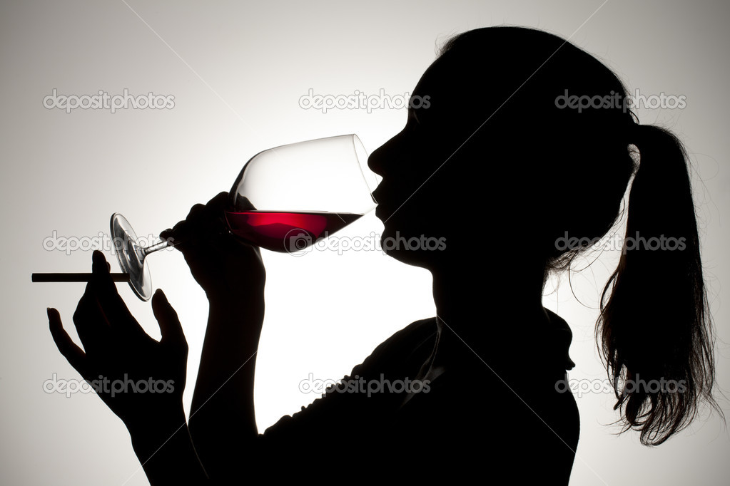 female drinking red wine while smoking