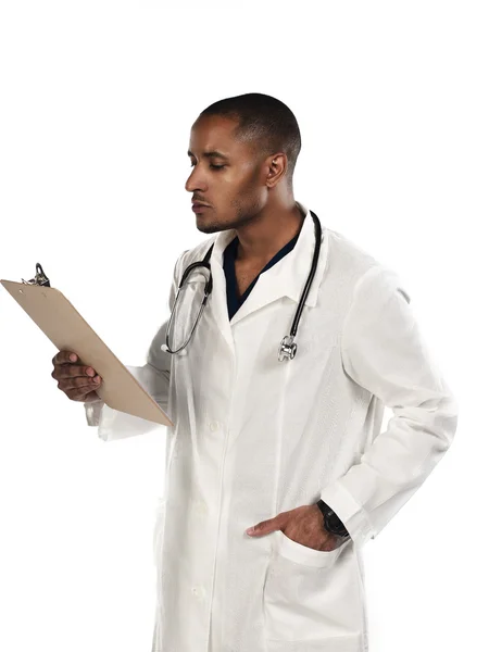 Doctor looking at clipboard — Stock Photo, Image