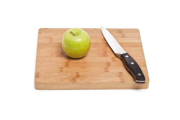 Apple and knife on a chopping board — Stock Photo, Image