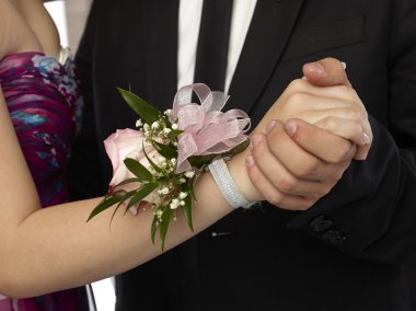 pink corsage in a woman wrist clipart