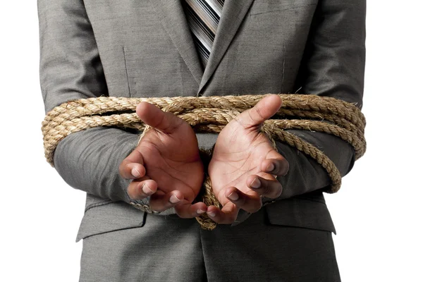 Mains d'homme d'affaires attachées avec corde — Photo