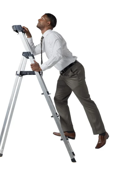 Businessman looking up while walking upstairs — Stock Photo, Image