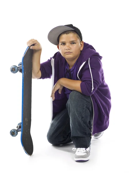 Serious kid with skateboard — Stock Photo, Image