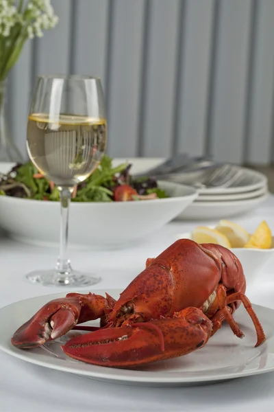 Dinner table with lobster and wine — Stock Photo, Image