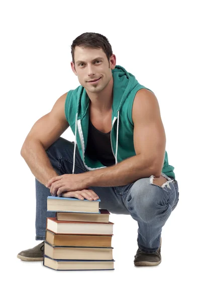 Goed uitziende man met stapel boeken — Stockfoto