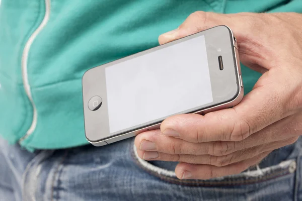 Lidská ruka drží mobilní telefon — Stock fotografie