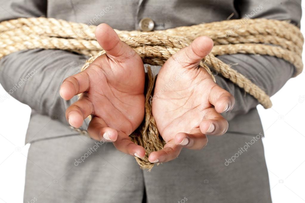 businessman hands tied up with rope