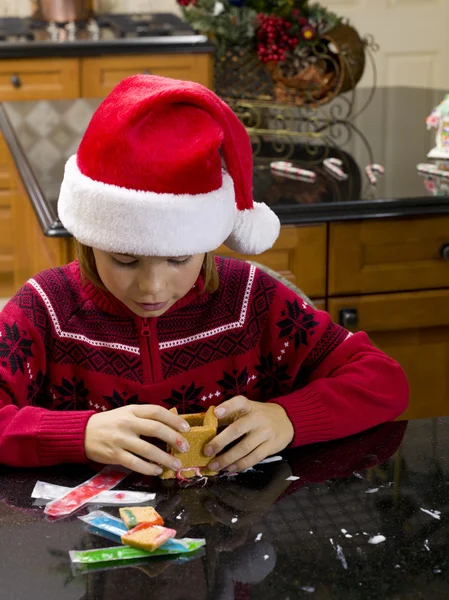 View of a boy making gingerbread house — Stock Photo, Image