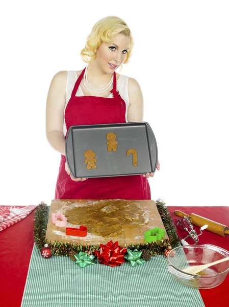 Woman displaying raw christmas cookies Royalty Free Stock Photos