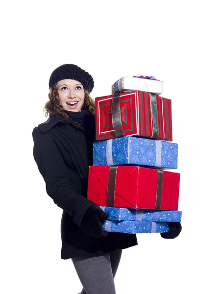 Fêmea alegre com uma pilha de presentes de Natal — Fotografia de Stock