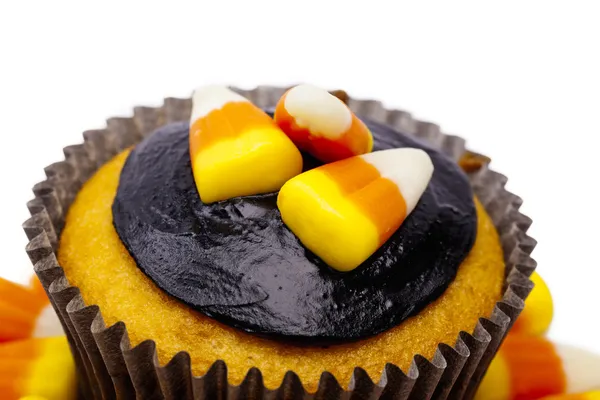 Close up of a cupcake with candy corn and chocolate cream — Stock Photo, Image