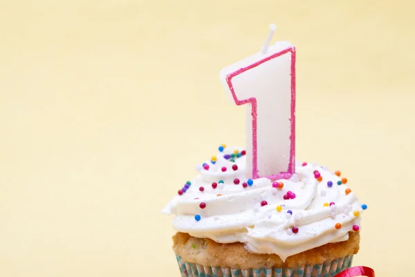 Cupcake with birthday candle of one year old — Stock Photo, Image