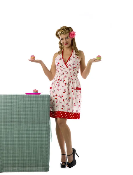 Portrait of a blonde woman posing with cupcakes — Stock Photo, Image