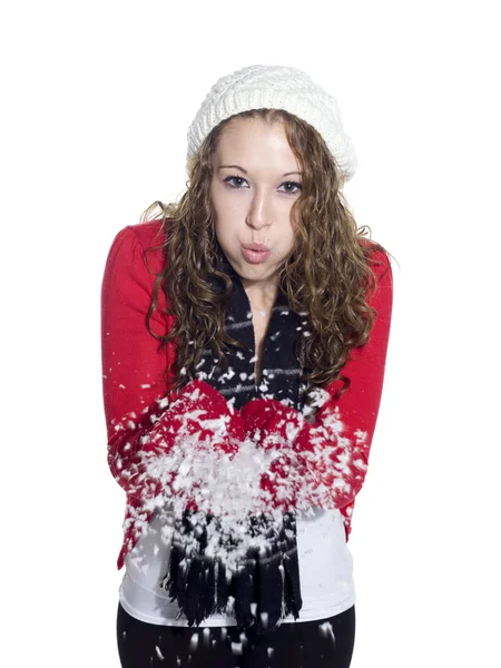 Portrait d'une jeune femme soufflant de la neige — Photo