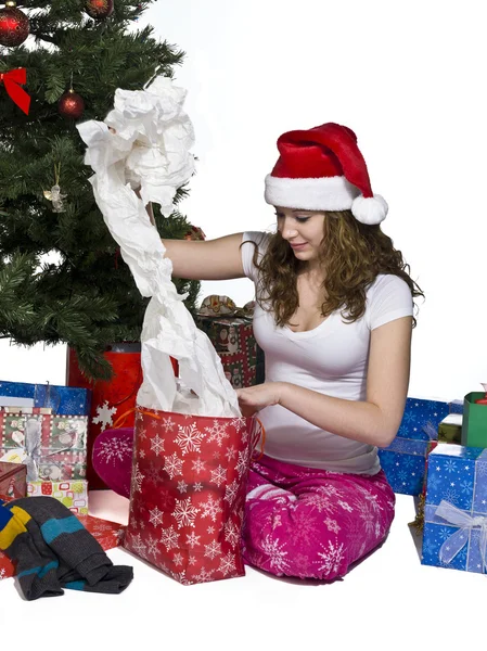 Pretty woman opening her christmas gift — Stock Photo, Image