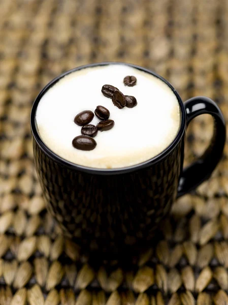 Cappuccino and beans — Stock Photo, Image