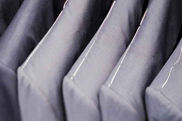 Close up of grey suits — Stock Photo, Image