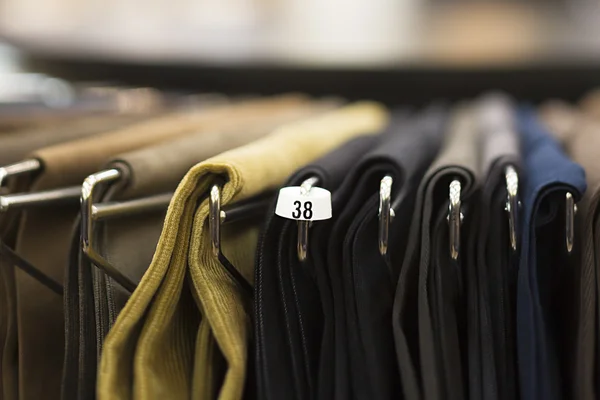 Trousers on rack — Stock Photo, Image