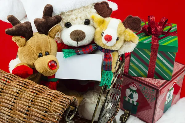 Jouets de Noël chevauchant dans un traîneau Photo De Stock