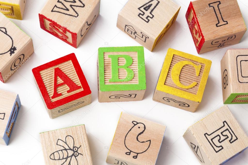 colorful playing cubes with alphabets abc