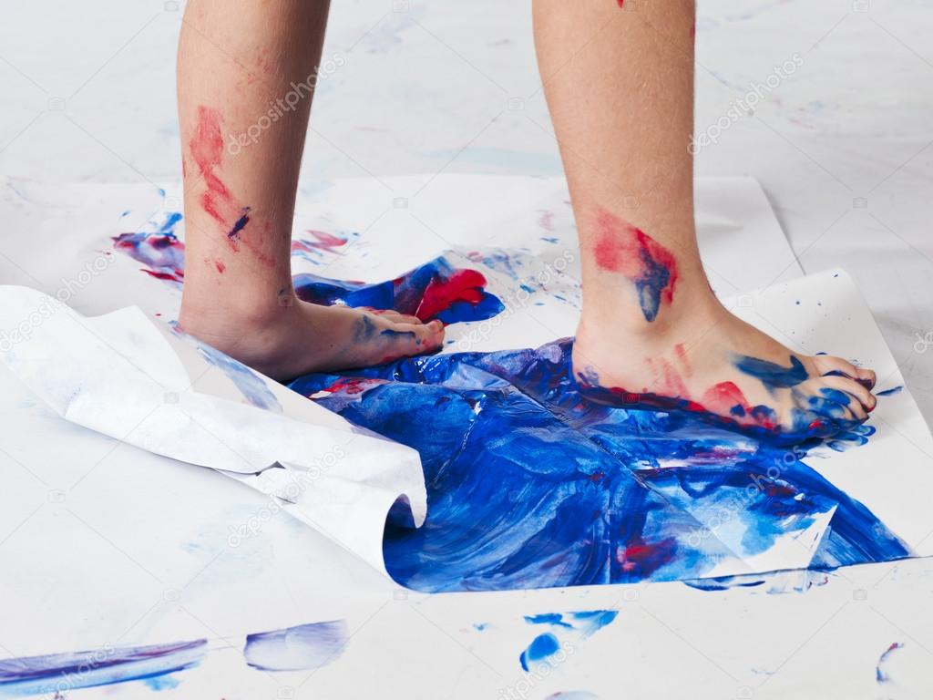 human foot printing color on piece of paper