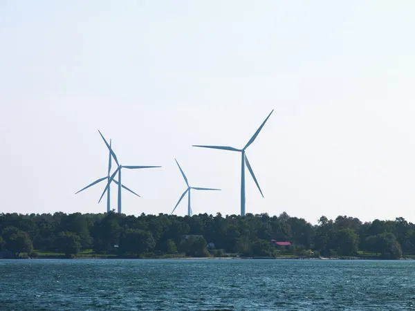River with wind turbines in the background — Stock Photo, Image