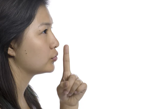 Asiatiska ung kvinna gestikulerande tystnad — Stockfoto