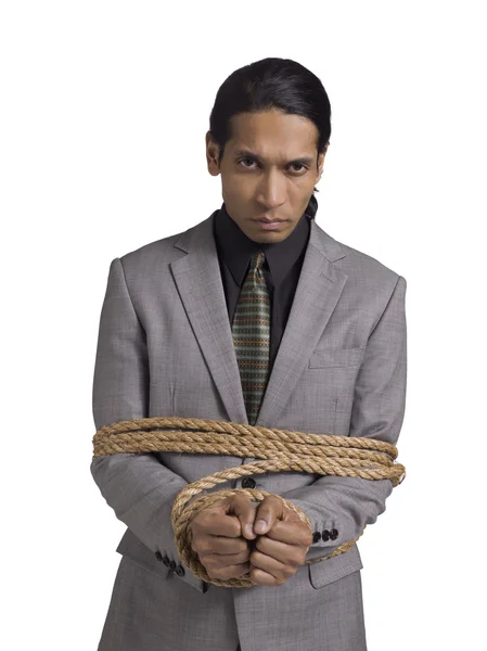 Businessman wrapped up with brown rope — Stock Photo, Image