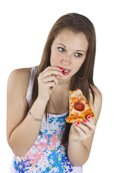 thoughtful teenage girl eating pizza