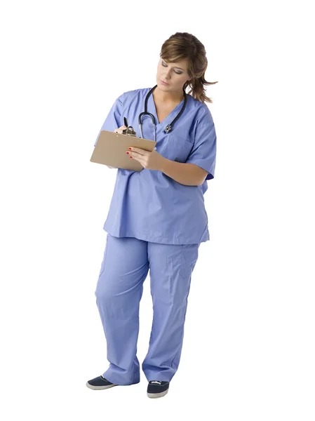 Female nurse writing something — Stock Photo, Image