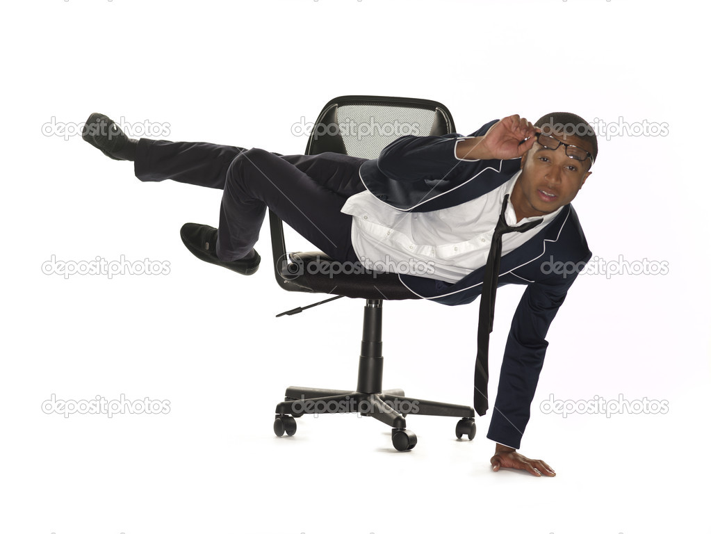 373 view of a businessman leaning on chair and adjusting spectac