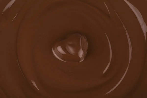 Geschmolzene Schokolade mit Herzform — Stockfoto