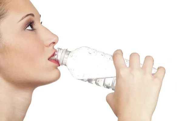 Teen model closup of drinking water out of clear water bottle — Stock Photo, Image