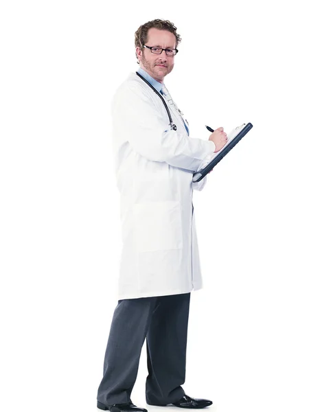 Happy young doctor writing reports — Stock Photo, Image