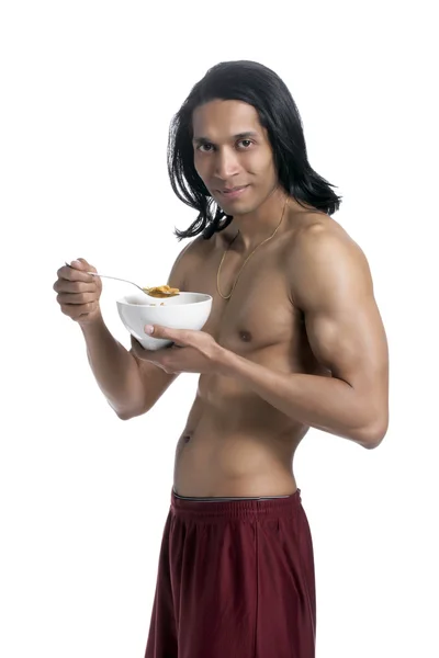 Macho man eating cereals — Stock Photo, Image