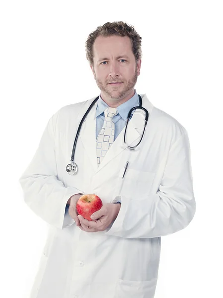 Portrait of a young doctor holding an apple — Stock Photo, Image