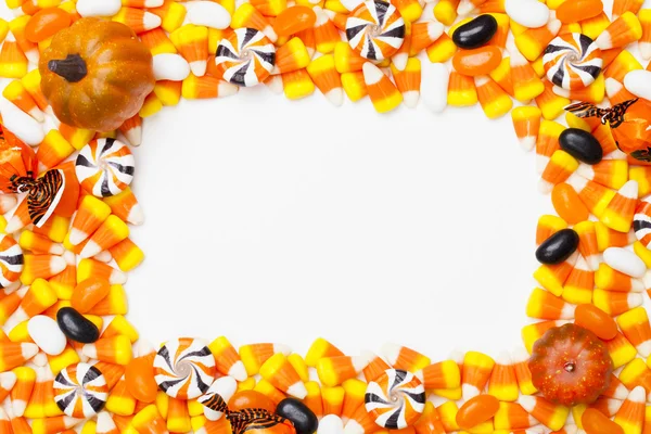 734 arranged candy corns and pumpkins — Stock Photo, Image