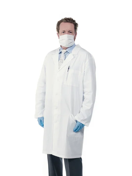 Young doctor wearing surgical mask and gloves — Stock Photo, Image