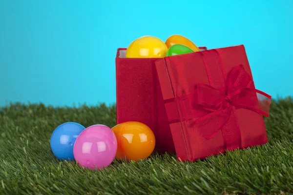 A box with easter eggs on the grass — Stock Photo, Image